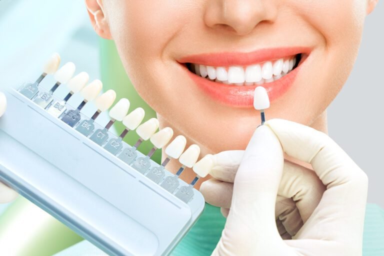Close up portrait of Young women in dentist chair, Check and select the color of the teeth. Dentist makes the process of treatment in dental clinic office